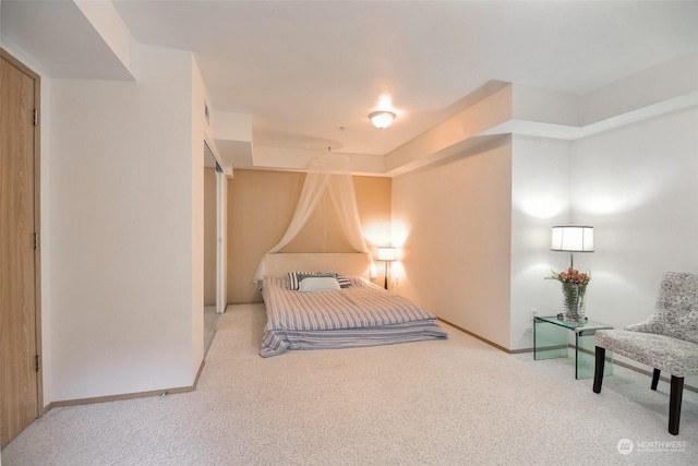 bedroom featuring carpet flooring and baseboards