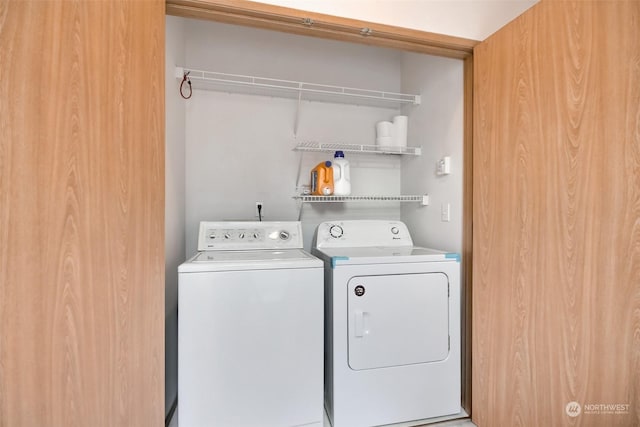 washroom with washing machine and dryer