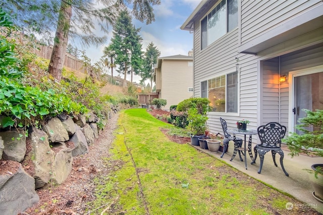 view of yard with a patio and fence