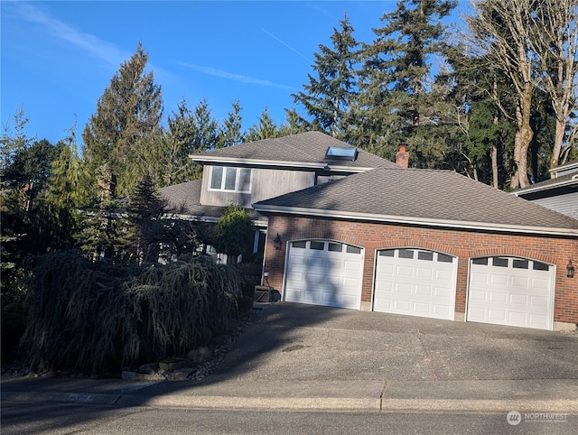 view of side of property featuring a garage