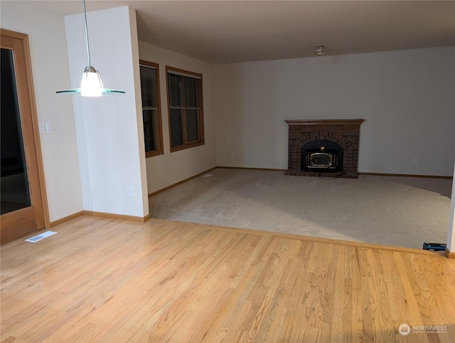 unfurnished living room featuring hardwood / wood-style floors