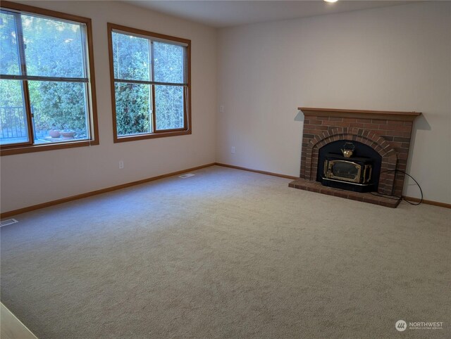 unfurnished living room with carpet flooring