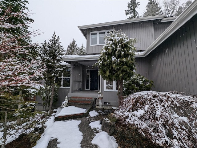 view of snow covered property