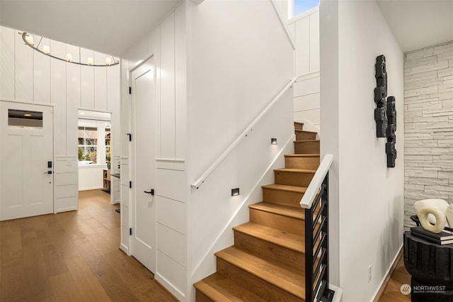 stairway with wood-type flooring