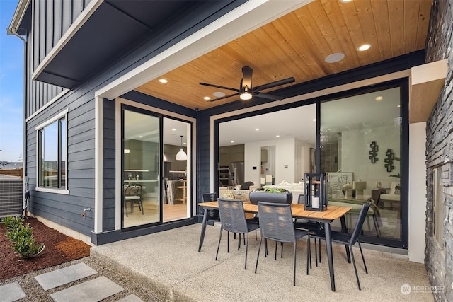 view of patio with central AC unit and ceiling fan