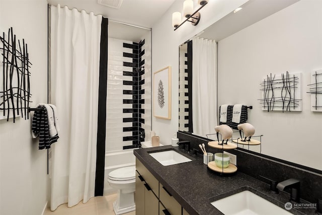 full bathroom featuring shower / tub combo, vanity, tile patterned flooring, and toilet