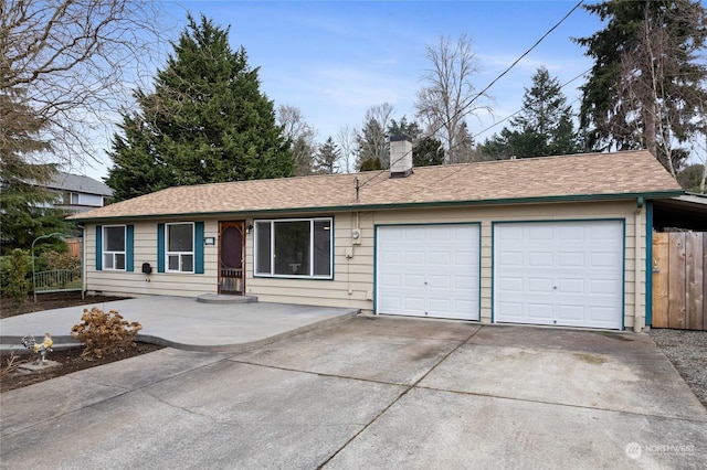 ranch-style home featuring a garage