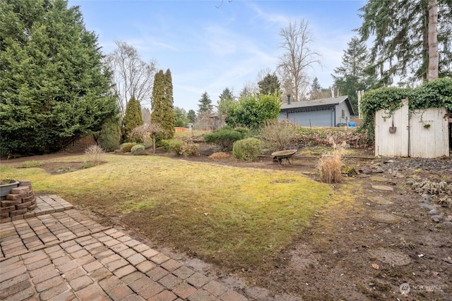 view of yard featuring a garage