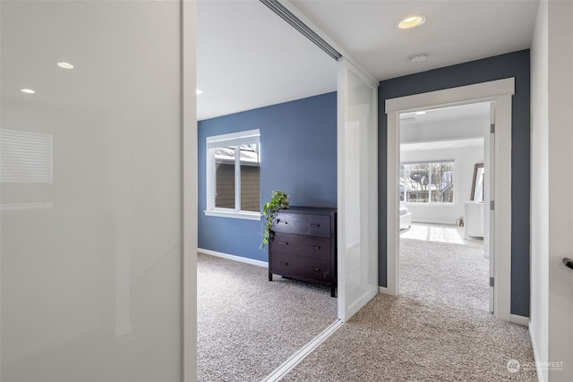 hallway with carpet flooring