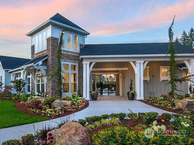 back house at dusk with a carport