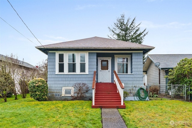 bungalow-style house with a front yard