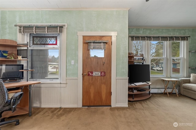 carpeted home office featuring a baseboard radiator and ornamental molding