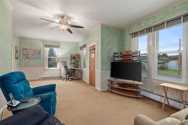 living room with crown molding, light carpet, ceiling fan, and baseboard heating