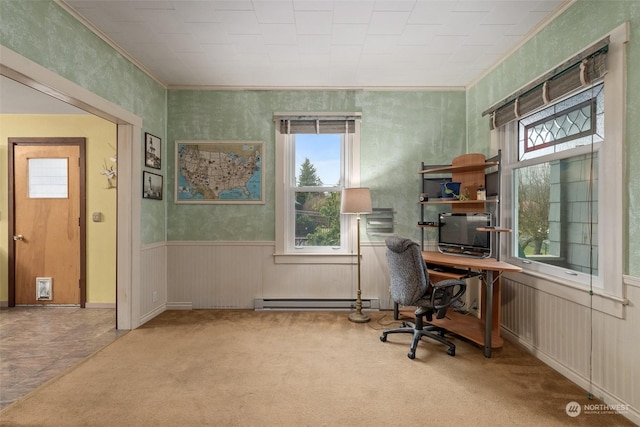 carpeted office featuring a baseboard heating unit and crown molding