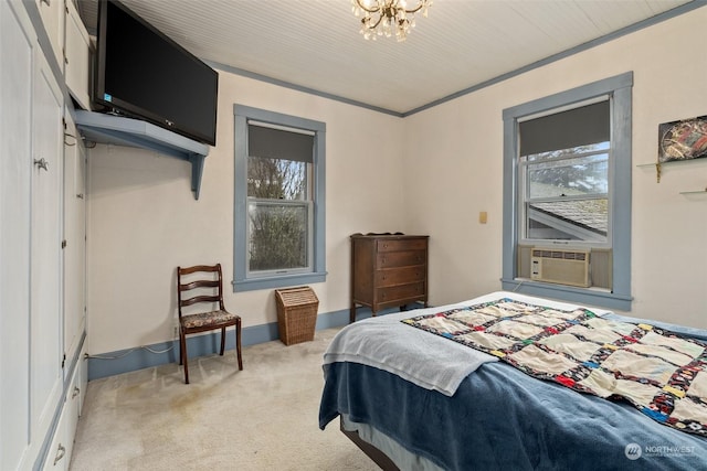 carpeted bedroom with multiple windows, cooling unit, and a chandelier