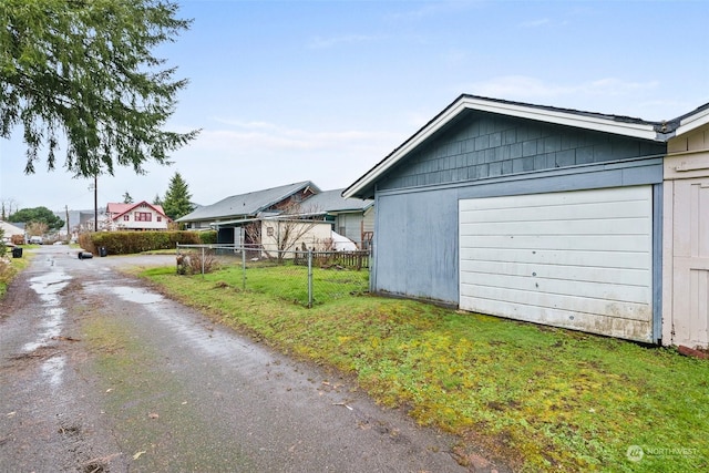 garage with a yard