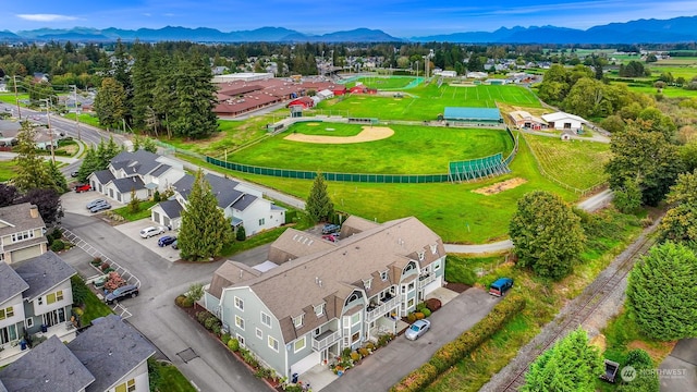 birds eye view of property featuring a mountain view