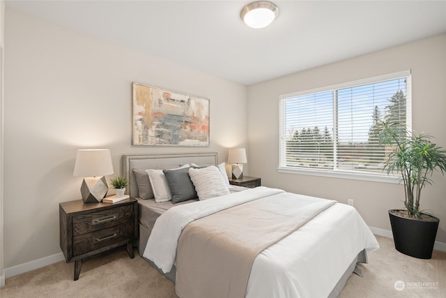 bedroom with light carpet