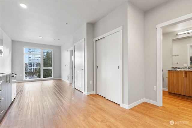 interior space with sink and light hardwood / wood-style floors