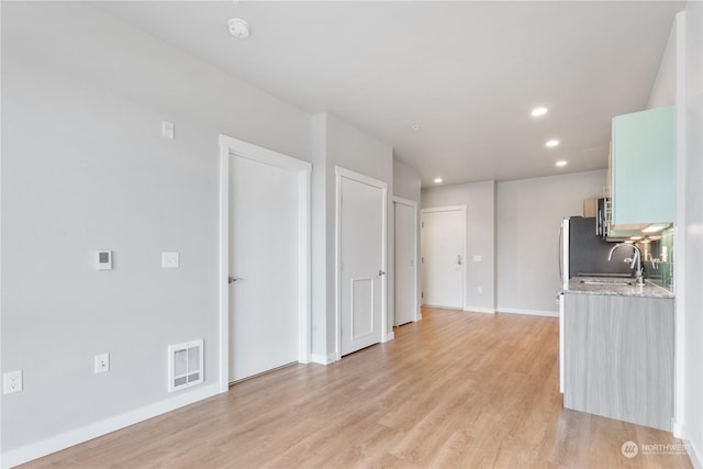 kitchen featuring light hardwood / wood-style floors and sink