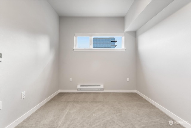 carpeted empty room with a baseboard radiator