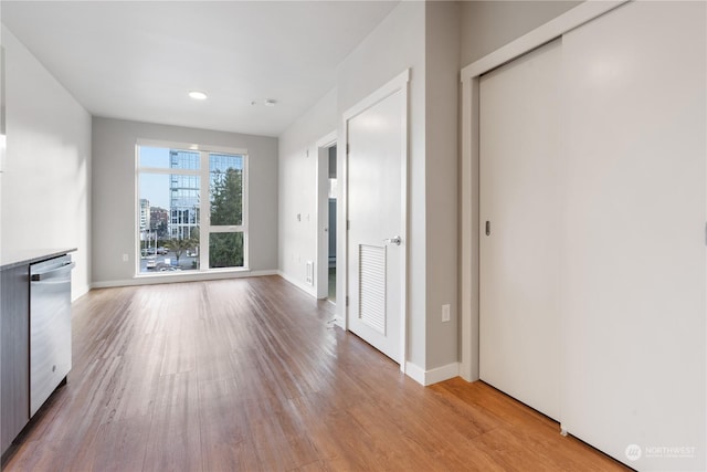 unfurnished living room with light wood-type flooring