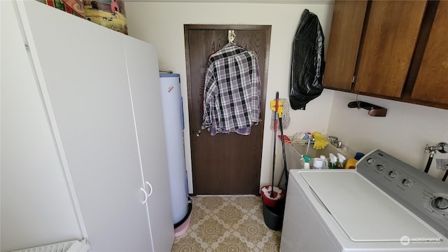 laundry area featuring cabinets, washer / clothes dryer, and electric water heater