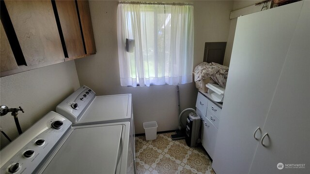 clothes washing area with washing machine and clothes dryer