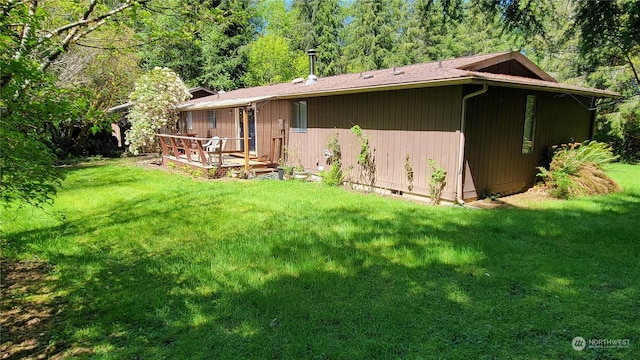 rear view of house with a lawn