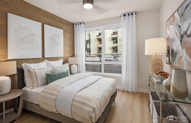 bedroom featuring ceiling fan and light hardwood / wood-style floors