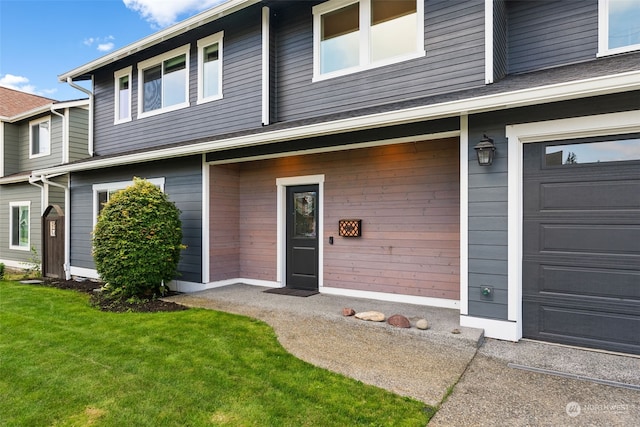 exterior space with a garage and a yard