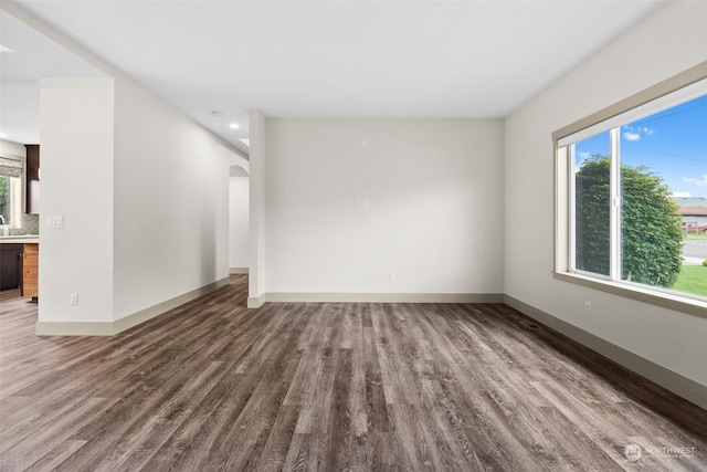 empty room with wood-type flooring