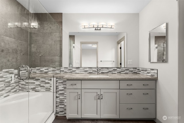 bathroom with vanity and decorative backsplash