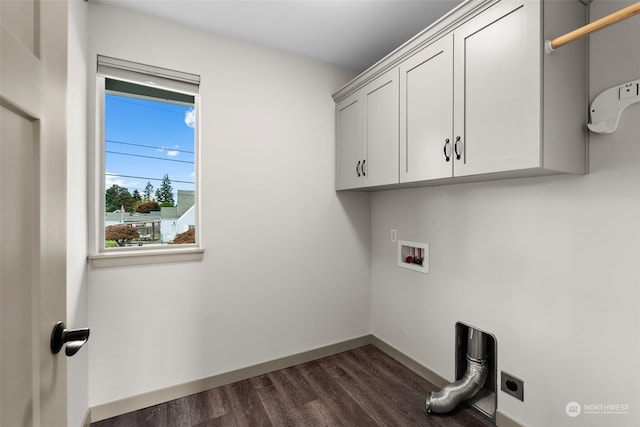 laundry room with electric dryer hookup, hookup for a washing machine, dark hardwood / wood-style flooring, and cabinets