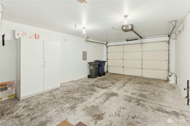 garage featuring a garage door opener and electric panel