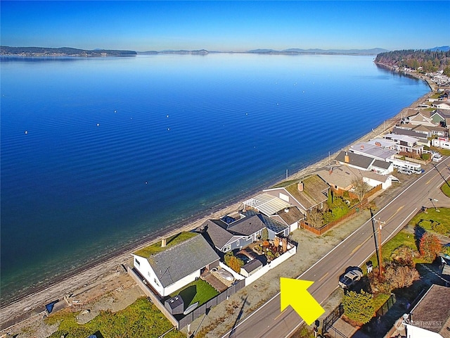 birds eye view of property featuring a water view and a view of the beach