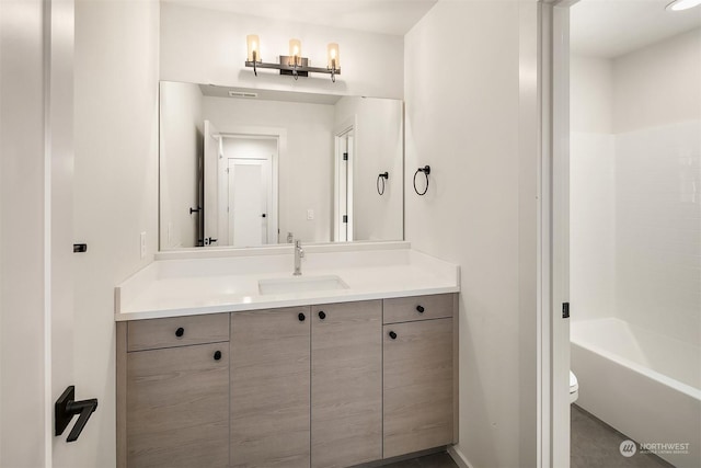 full bathroom with vanity, toilet, and shower / bath combination