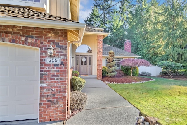 property entrance with a yard