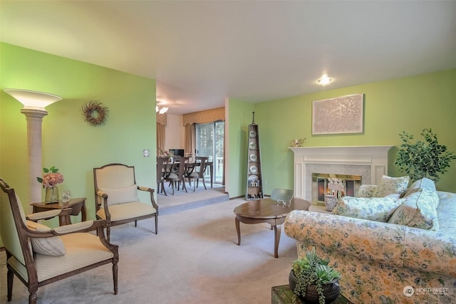 living room featuring light carpet and a fireplace