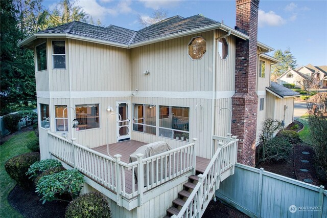 rear view of property with a deck