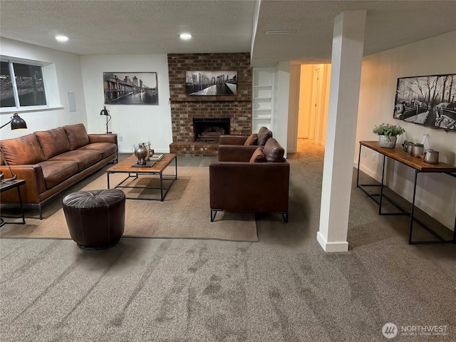 living room with carpet floors, a fireplace, visible vents, a textured ceiling, and baseboards