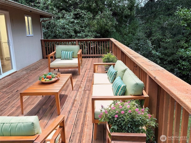 wooden terrace featuring an outdoor hangout area