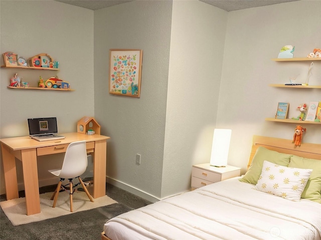 carpeted bedroom featuring baseboards