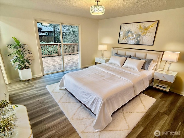 bedroom with access to outside, a textured ceiling, baseboards, and wood finished floors