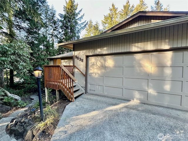 view of home's exterior featuring driveway and a garage