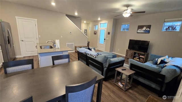 living room featuring dark wood-style floors, recessed lighting, visible vents, a ceiling fan, and baseboards