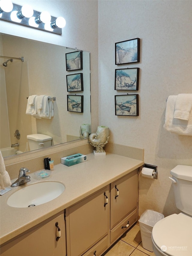 full bathroom featuring tile patterned flooring, vanity, shower / washtub combination, and toilet