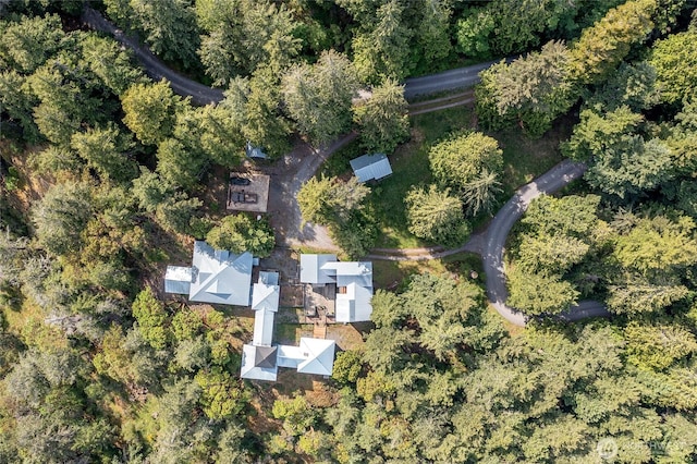 bird's eye view featuring a forest view