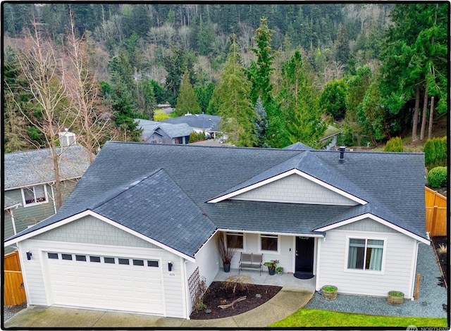 view of front of home featuring a garage and a patio