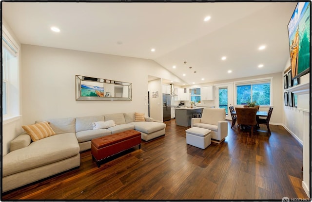 living room with lofted ceiling and dark hardwood / wood-style flooring